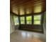 Sunroom with tile floors and three windows at 127 W Palmetto Ave, Deland, FL 32720
