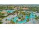 Expansive resort-style pool complex with multiple pools, cabanas, and lounge areas at 1427 Wexford Way, Davenport, FL 33896