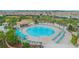 Community pool with surrounding lounge chairs and cabanas at 1427 Wexford Way, Davenport, FL 33896