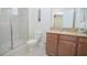 Bathroom with shower, toilet and granite vanity at 1427 Wexford Way, Davenport, FL 33896