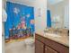 Bathroom with granite vanity and shower at 1427 Wexford Way, Davenport, FL 33896