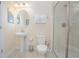 Clean bathroom with a pedestal sink, toilet, and walk-in shower at 1427 Wexford Way, Davenport, FL 33896