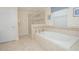 Luxurious bathroom with soaking tub and separate shower at 1427 Wexford Way, Davenport, FL 33896
