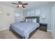 Main bedroom with a large bed and nightstands at 1427 Wexford Way, Davenport, FL 33896