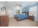 Main bedroom with a king-size bed and double door closet at 1427 Wexford Way, Davenport, FL 33896