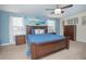 Bedroom with king-size bed and golf-themed decor at 1427 Wexford Way, Davenport, FL 33896