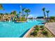 Inviting pool area with a waterslide and palm trees at 1427 Wexford Way, Davenport, FL 33896