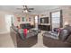 Game room with leather sofas and a large TV at 1427 Wexford Way, Davenport, FL 33896
