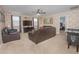 Spacious game room, leather sofas, and arcade game at 1427 Wexford Way, Davenport, FL 33896