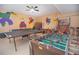 Game room with ping pong, foosball, and basketball game at 1427 Wexford Way, Davenport, FL 33896