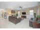 Bright and airy living room with comfortable seating and a large TV at 1427 Wexford Way, Davenport, FL 33896