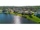 Aerial view of lakeside community, showcasing waterfront properties and lush greenery at 164 Pergola Pl, Ormond Beach, FL 32174