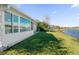 Enjoy the privacy of the backyard with views of the lake, creating a serene and relaxing atmosphere at 164 Pergola Pl, Ormond Beach, FL 32174