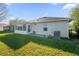 Backyard view with patio and lush grass at 164 Pergola Pl, Ormond Beach, FL 32174