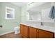 Fresh bathroom with a sink and vanity, matching tile floors, and coordinated light fixtures at 164 Pergola Pl, Ormond Beach, FL 32174
