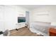 Simple bedroom featuring wood laminate flooring and a comfortable sleeping area at 164 Pergola Pl, Ormond Beach, FL 32174