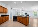 Open concept kitchen with an island and views into living room at 164 Pergola Pl, Ormond Beach, FL 32174