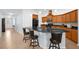 Kitchen featuring a breakfast bar, modern appliances, and granite countertops at 164 Pergola Pl, Ormond Beach, FL 32174