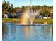 Scenic lake view featuring a fountain with a colorful rainbow on a sunny day at 164 Pergola Pl, Ormond Beach, FL 32174