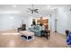 Open-concept living area with tile flooring, neutral paint, and seamless flow to kitchen at 164 Pergola Pl, Ormond Beach, FL 32174
