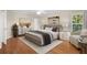 Comfortable main bedroom features stylish decor, ample natural light, and hardwood flooring at 164 Pergola Pl, Ormond Beach, FL 32174