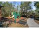 The community playground features slides and play equipment, perfect for Gathering fun and recreation at 164 Pergola Pl, Ormond Beach, FL 32174