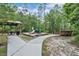 Community playground with a picnic table and bridge to enter at 164 Pergola Pl, Ormond Beach, FL 32174