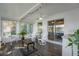 Serene sunroom with lake view and ceiling fan at 164 Pergola Pl, Ormond Beach, FL 32174