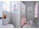 Bathroom with toilet, shower, and decorative accents at 16767 Rusty Anchor Rd, Winter Garden, FL 34787
