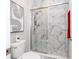 Bathroom with marble shower and toilet at 16767 Rusty Anchor Rd, Winter Garden, FL 34787