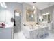 Spa-like bathroom with marble finishes and a large shower at 16767 Rusty Anchor Rd, Winter Garden, FL 34787