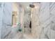 Spa-like bathroom with marble shower and double shower heads at 16767 Rusty Anchor Rd, Winter Garden, FL 34787