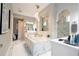 Luxurious bathroom with marble finishes and a large tub at 16767 Rusty Anchor Rd, Winter Garden, FL 34787