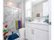 Bathroom with marble shower and modern vanity at 16767 Rusty Anchor Rd, Winter Garden, FL 34787