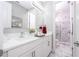 Modern bathroom with white cabinets, quartz countertop, and marble shower at 16767 Rusty Anchor Rd, Winter Garden, FL 34787