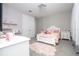 Spacious bedroom with white dresser and pink bedding at 16767 Rusty Anchor Rd, Winter Garden, FL 34787