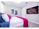 Bedroom with queen-size bed and large TV at 16767 Rusty Anchor Rd, Winter Garden, FL 34787
