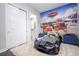 bedroom with race car bed and Cars mural at 16767 Rusty Anchor Rd, Winter Garden, FL 34787