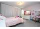 Pink-themed bedroom with TV and plush seating at 16767 Rusty Anchor Rd, Winter Garden, FL 34787