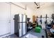 Garage with extra storage, bikes, and refrigerator at 16767 Rusty Anchor Rd, Winter Garden, FL 34787