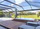 Relax in this covered hot tub with deck and lounge chairs at 16767 Rusty Anchor Rd, Winter Garden, FL 34787