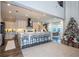 Open concept kitchen with island, stainless steel appliances, and hardwood floors at 16767 Rusty Anchor Rd, Winter Garden, FL 34787