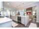 Modern kitchen with large island, stainless steel appliances, and white cabinets at 16767 Rusty Anchor Rd, Winter Garden, FL 34787