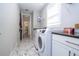 Clean laundry room with washer, dryer, and access to pantry at 16767 Rusty Anchor Rd, Winter Garden, FL 34787