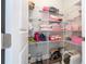 Well-organized linen closet with wire shelving at 16767 Rusty Anchor Rd, Winter Garden, FL 34787