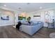 Living area with gray sectional sofa and large TV at 16767 Rusty Anchor Rd, Winter Garden, FL 34787