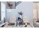 Elegant living room with two armchairs and a coffee table at 16767 Rusty Anchor Rd, Winter Garden, FL 34787