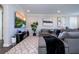 Living room with sectional sofa, hardwood floors, and large TV at 16767 Rusty Anchor Rd, Winter Garden, FL 34787