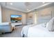 Bright bedroom with large TV and comfortable seating at 16767 Rusty Anchor Rd, Winter Garden, FL 34787