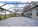 Large covered patio with hot tub and seating at 16767 Rusty Anchor Rd, Winter Garden, FL 34787